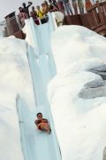 A guest takes a plunge on Slush Gusher at Disney’s Blizzard Beach waterpark.